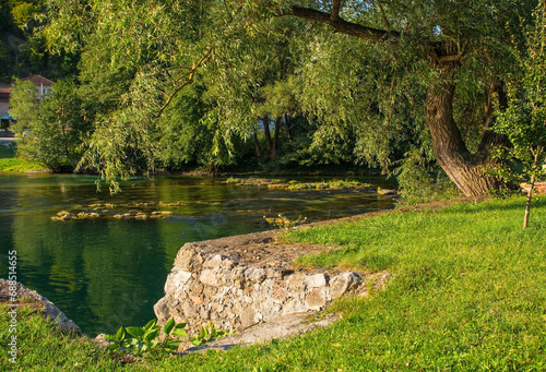 The River Una as it passes through Kulen Vakuf village in the Una National Park. Una-Sana Canton, Federation of Bosnia and Herzegovina. Early September photo