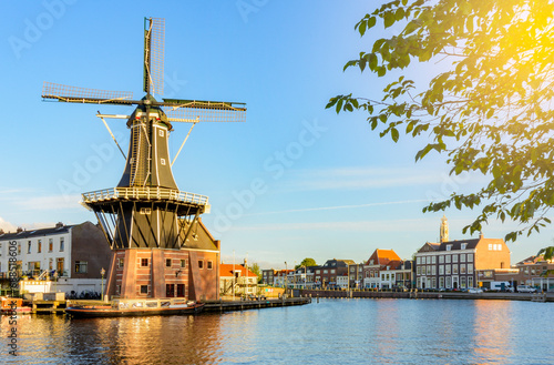 Traditional windmill and Haarlem canals, Netherlands photo