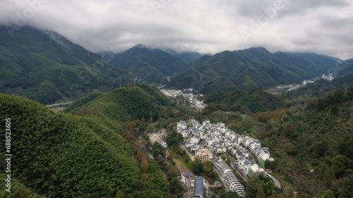 Aerial shot of Mount Huangshan forest winding mountain road in Anhui