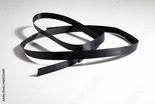 Slika na platnu Nylon cord strap for industrial use isolated on white background, close up plastic poly strap for cargo box