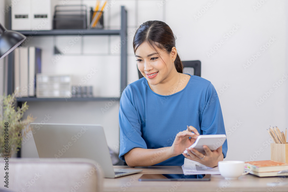 Asian Business woman work in home. concept of tax, report, accounting, statistics, and analytical research. Asian Business woman work in home. concept of tax, report, accounting, statistics, and analytical research.