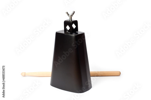Billede på lærred Cowbell percussion musical instrument, black metal with a wooden stick