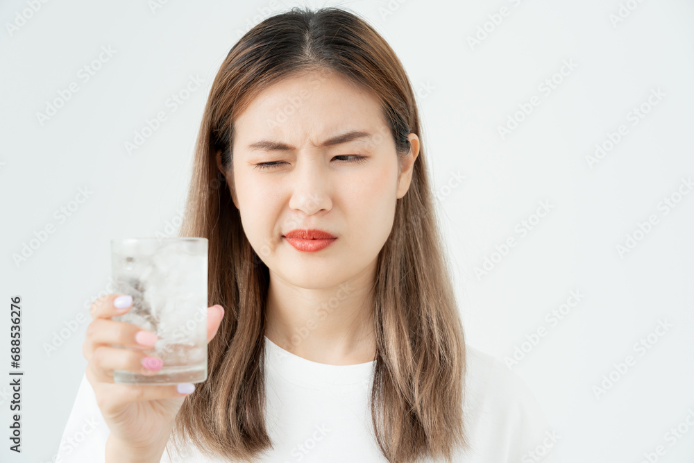 Asian woman feel sensitive teeth after drinking cold, female suffer tooth, decay problems, dental care, tooth extraction, decay problem, bad breath, Gingival Recession, Oral Hygiene instruction Asian woman feel sensitive teeth after drinking cold, female suffer tooth, decay problems, dental care, tooth extraction, decay problem, bad breath, Gingival Recession, Oral Hygiene instruction