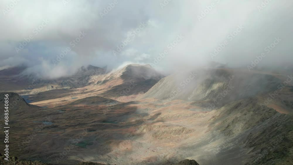 Aerial view of cloudy mountains in French Pyrenees during autumn. Aerial view of cloudy mountains in French Pyrenees during autumn.