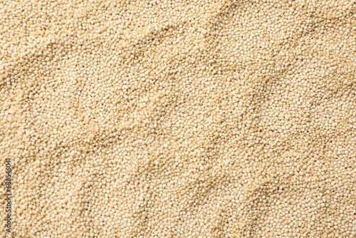Raw quinoa seeds as background, top view