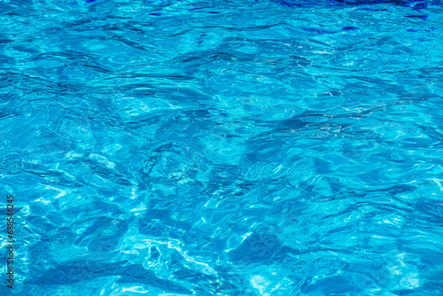 blue water background swimming pool © Iliya Mitskavets