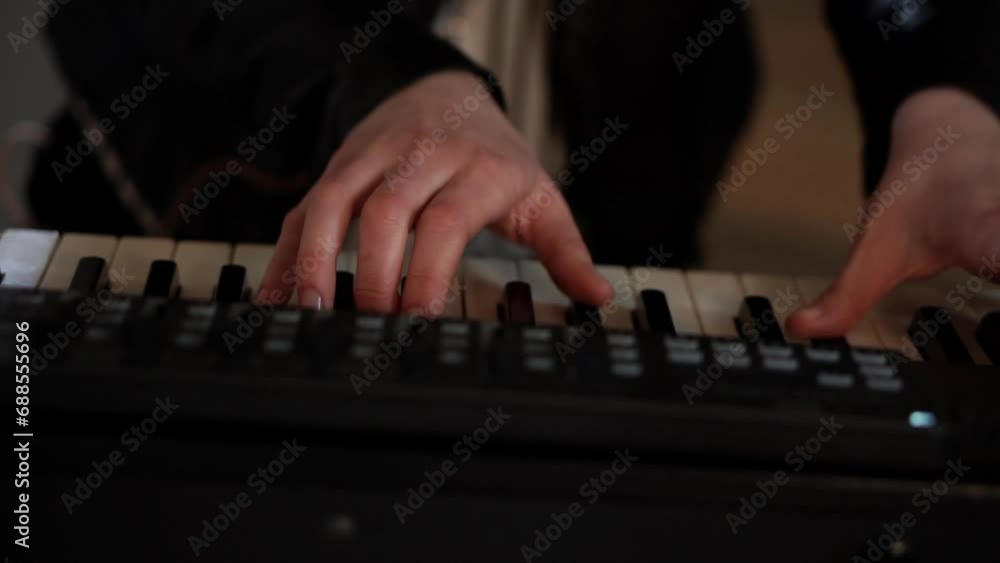 The musician plays the piano, the synthesizer. Hands playing chords close-up. slow motion. Music The musician plays the piano, the synthesizer. Hands playing chords close-up. slow motion. Music