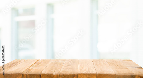 Perspective light empty wooden table from above on blurred background can be used mockup to display installation products or design layout.