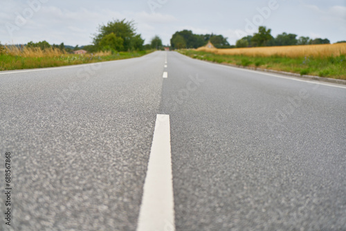 Wallpaper Mural Close-up of lane markings on empty asphalt road in rural Sweden Torontodigital.ca