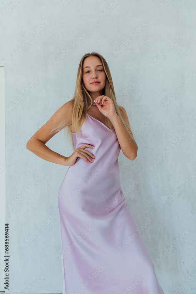 Portrait of a beautiful blonde woman in a dress Portrait of a beautiful blonde woman in a dress