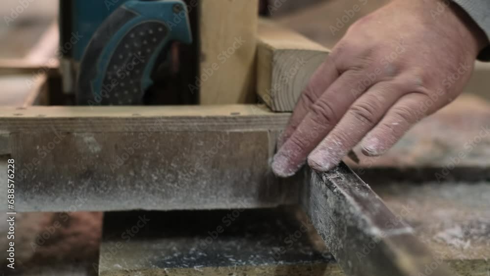 Expert hands guide wood through machinery. This image ties into the narrative of preserving traditional craftsmanship in a digital age. Expert hands guide wood through machinery. This image ties into the narrative of preserving traditional craftsmanship in a digital age.