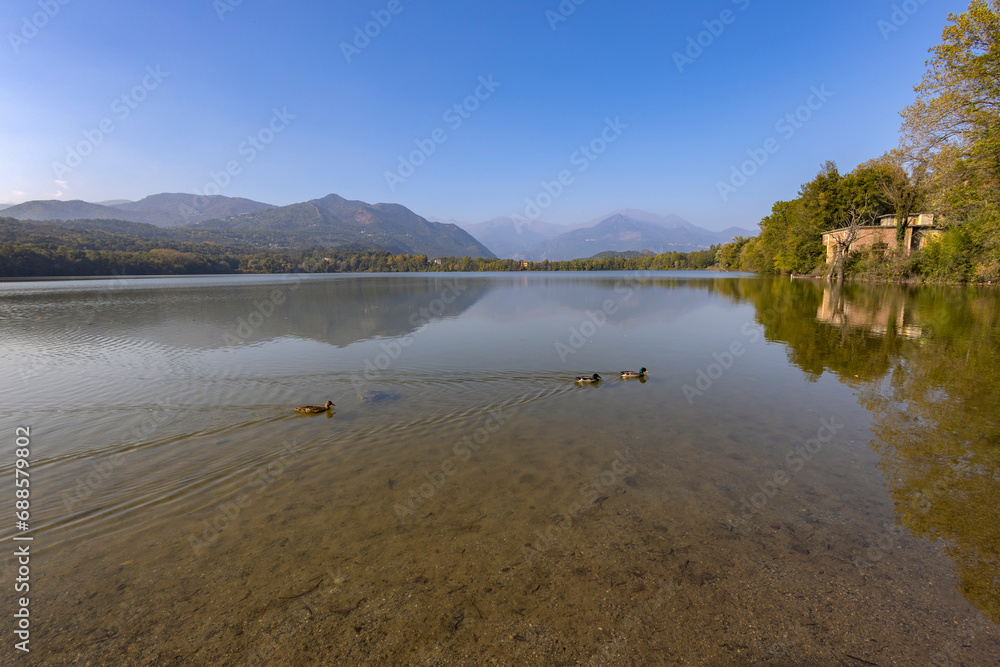 View of the big lake of Avigliana (Lago Grande), in the province of Turin, Piedmont, Italy View of the big lake of Avigliana (Lago Grande), in the province of Turin, Piedmont, Italy