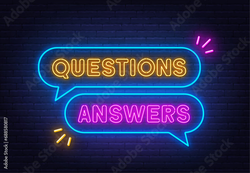 Questions Answers neon sign in the speech bubble on brick wall background.
