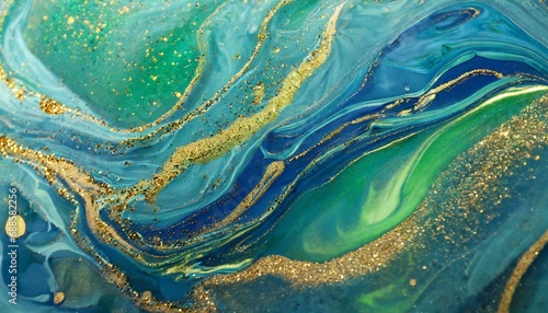 abstract magic blue background with golden sparkles photo of a blue liquid with gold glitters and green tints various shades of green and blue with golden splashes and flows
