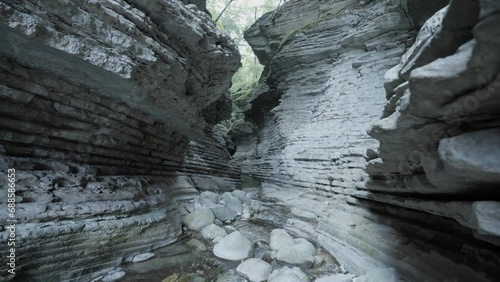Small canyon with water stream photo