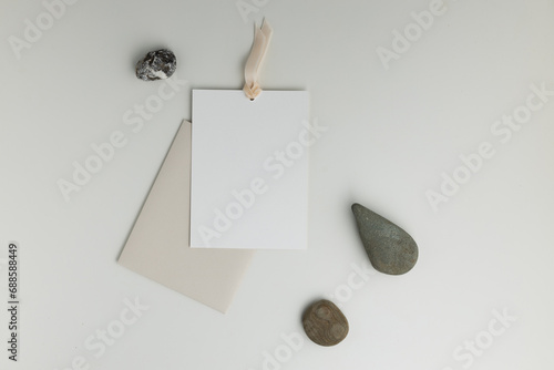 A composition with stones and an envelope with a postcard