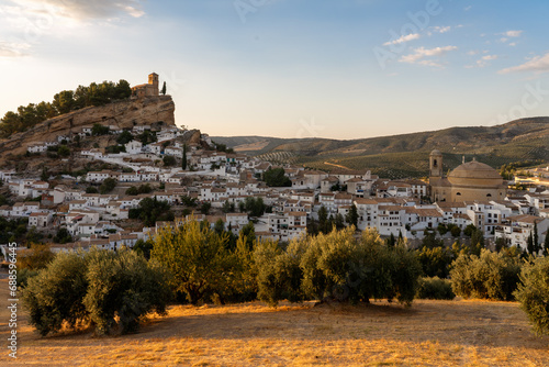Panoramic view of Montefrio since National Geographic lookout with olive trees in the foreground at sunset. Granada, Andalucia, Spain. photo