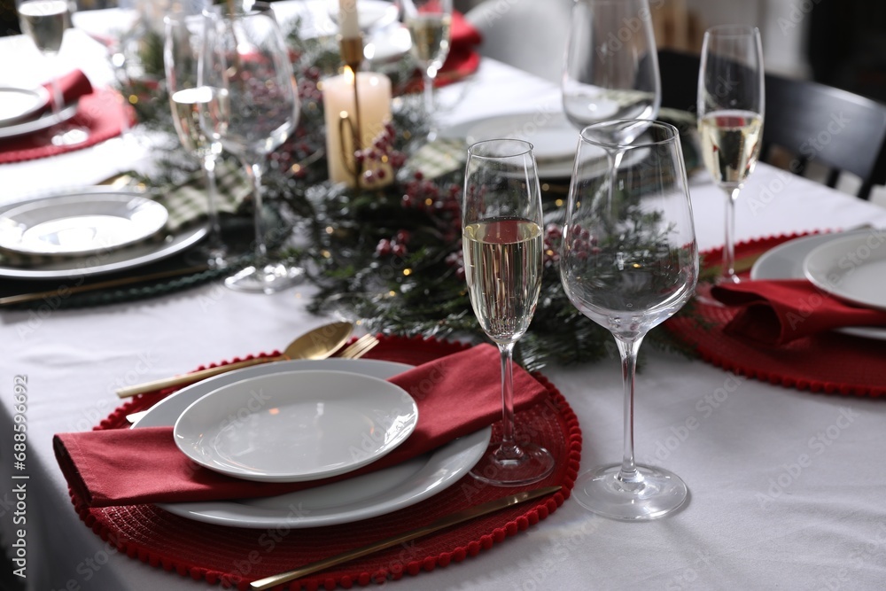 Christmas table setting with festive decor and dishware Christmas table setting with festive decor and dishware