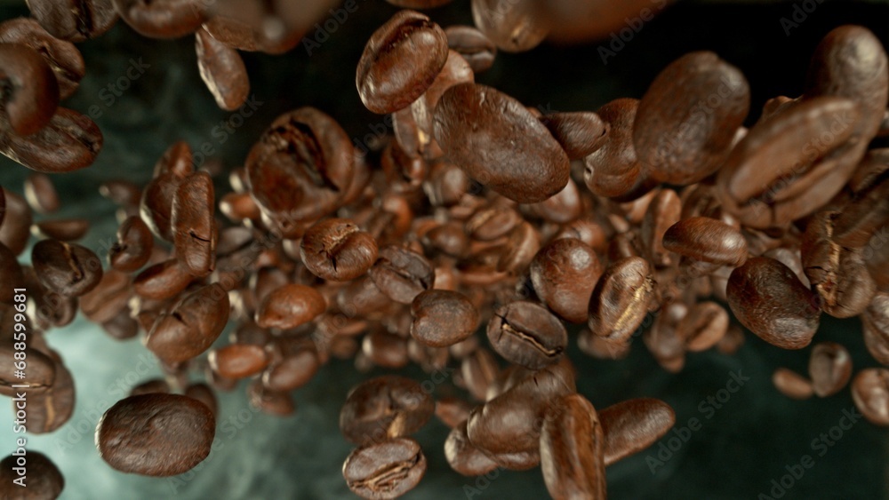 Obraz premium Freeze Motion of Falling Roasted Coffee Beans.