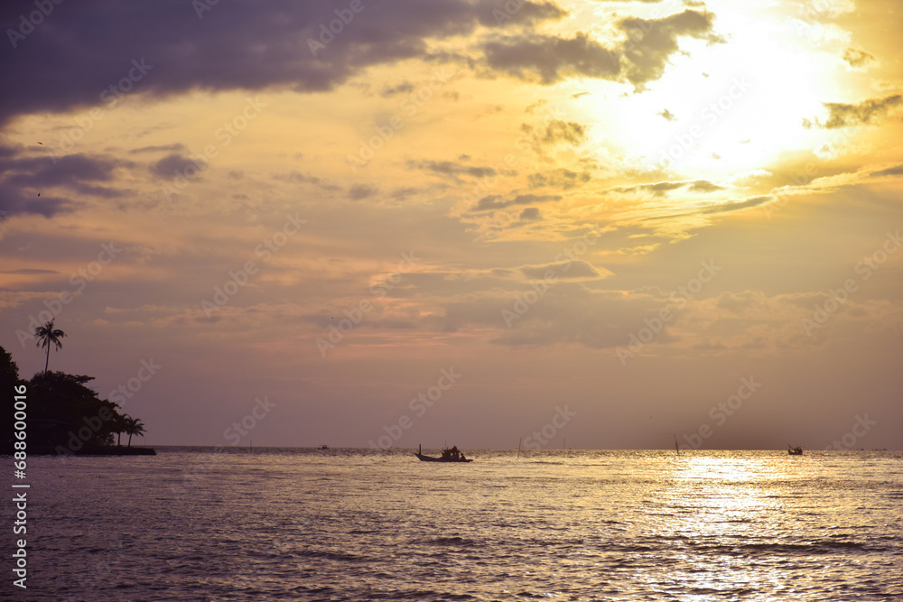 sunset on sea with boat