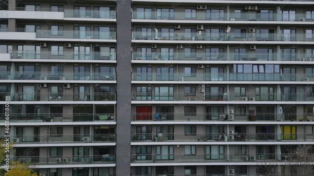 Drone flight along the facade of a modern office or residential building background Drone flight along the facade of a modern office or residential building background