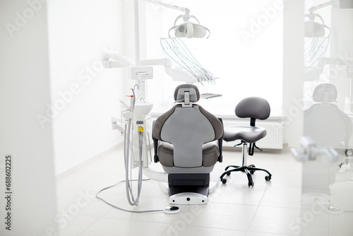 Dentist's office interior with modern chair and special dentisd equipment. Dentist office. Dentist chair in high class dental clinic. Dentist office. Medical concept. photo