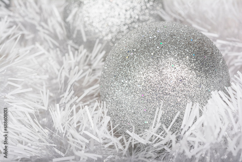 Christmas and New Year background of white garlands and silver ball