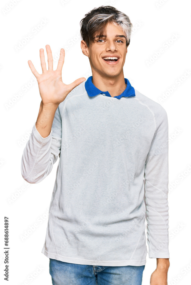 Young hispanic man wearing casual clothes showing and pointing up with fingers number five while smiling confident and happy. Young hispanic man wearing casual clothes showing and pointing up with fingers number five while smiling confident and happy.