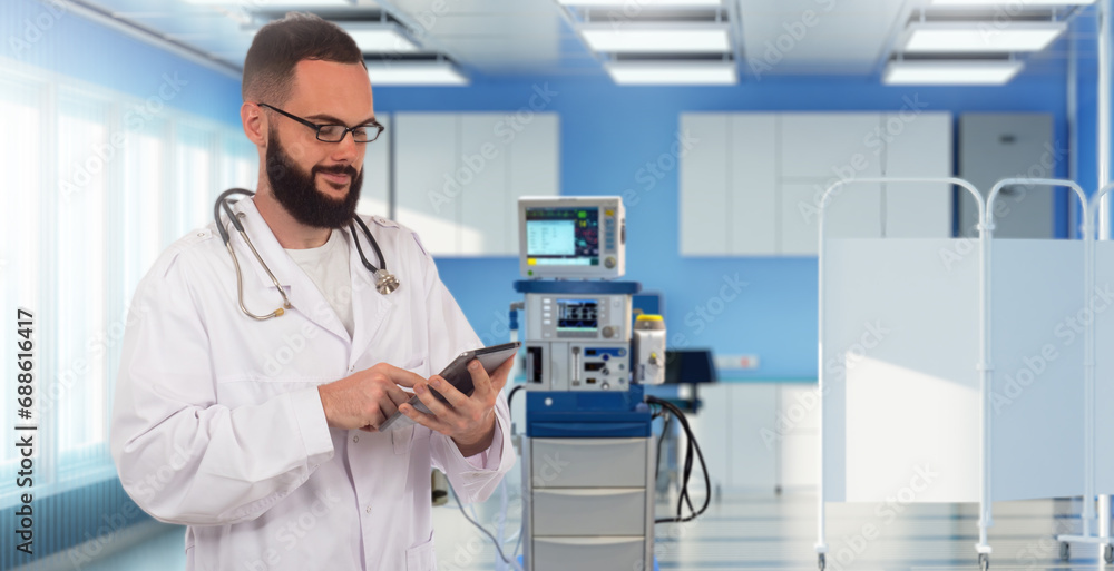 Doctor anesthesiologist. Man in hospital. Clinic employee with tablet. Doctor near anesthesiology equipment. Professional physician. Anesthesiologist stands in clinic. Man specialist treating people Doctor anesthesiologist. Man in hospital. Clinic employee with tablet. Doctor near anesthesiology equipment. Professional physician. Anesthesiologist stands in clinic. Man specialist treating people
