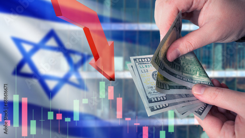 Business in Israel. Money in hands of man. Flag of Israel. Down arrow metaphor for crisis. Investment chart. Problems in Israeli economy concept. Problems for business from Israel. photo