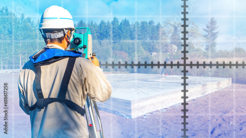 Man surveyor. Guy uses opti...