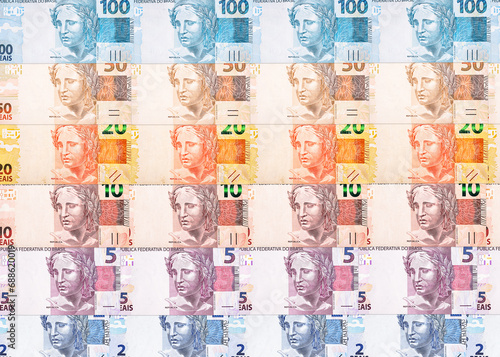 Wallpaper Mural texture or background with Brazilian money banknotes, 100, 50, 20, 10 5 and 2 reais. Brazilian currency paper Torontodigital.ca