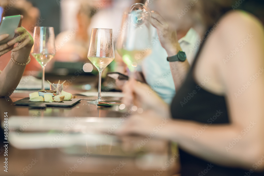 Group of People Enjoying Wine at an Event Group of People Enjoying Wine at an Event