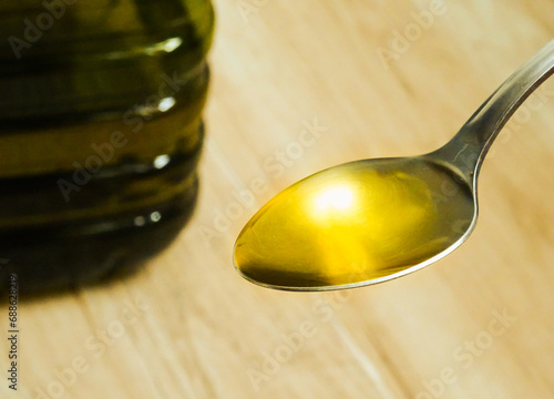 Olive oil in a spoon. Healthy cooking concept
