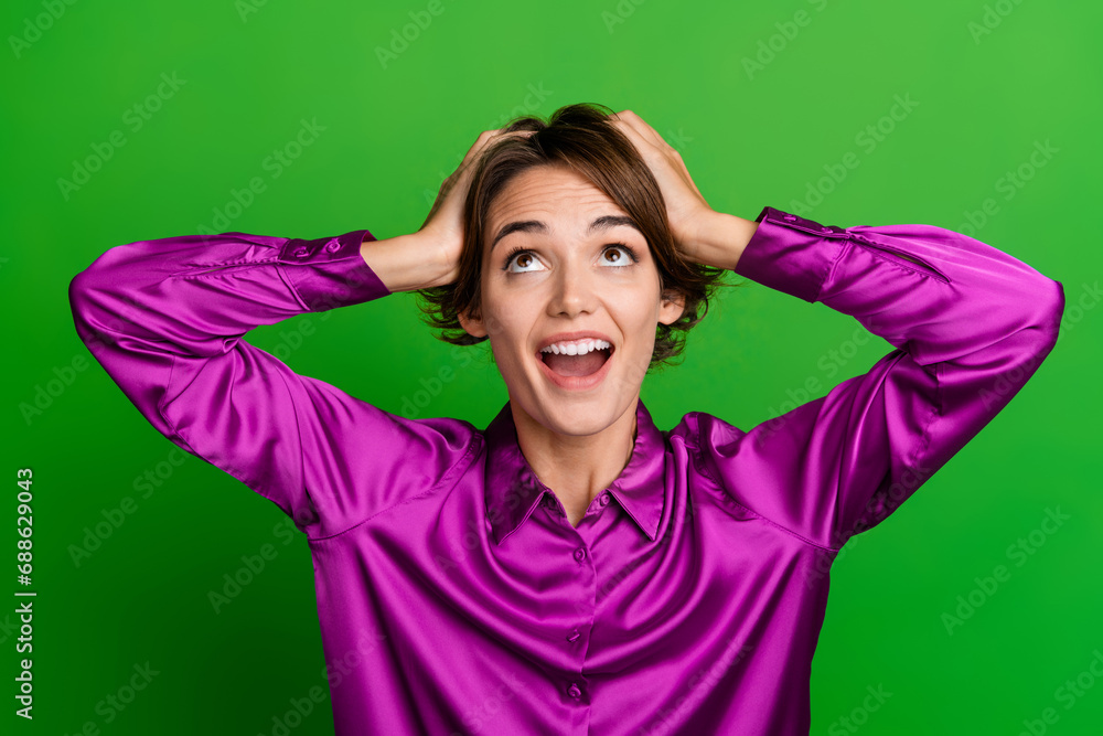 Photo of crazy cheerful lady wear violet trendy clothes shocked special holidays offer empty space isolated on green color background Photo of crazy cheerful lady wear violet trendy clothes shocked special holidays offer empty space isolated on green color background
