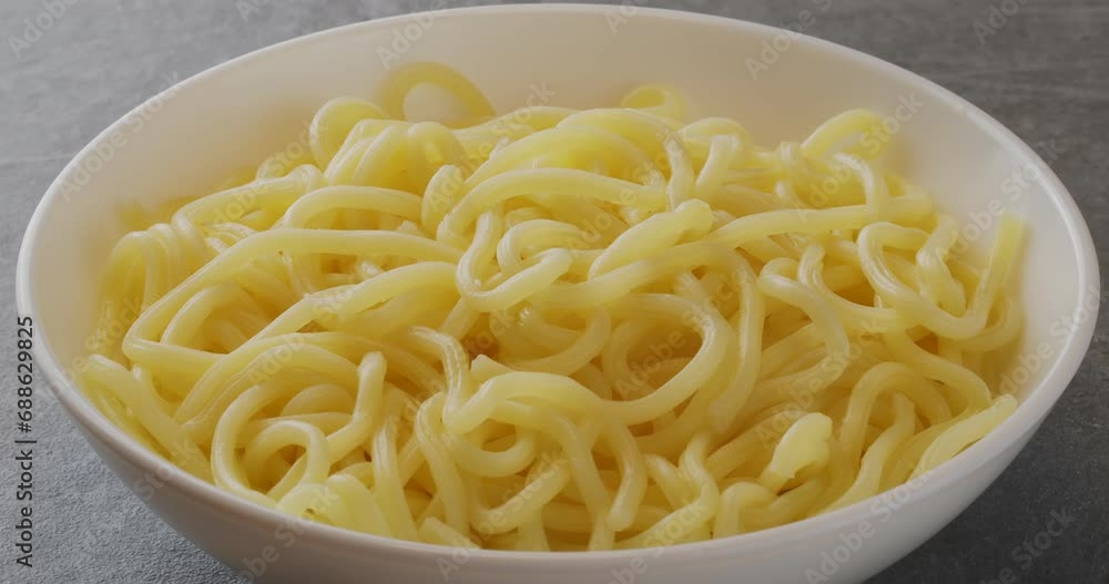 Soup ramen noodles in ceramic bowl. Close-up footage on the rotating table. Soup ramen noodles in ceramic bowl. Close-up footage on the rotating table.