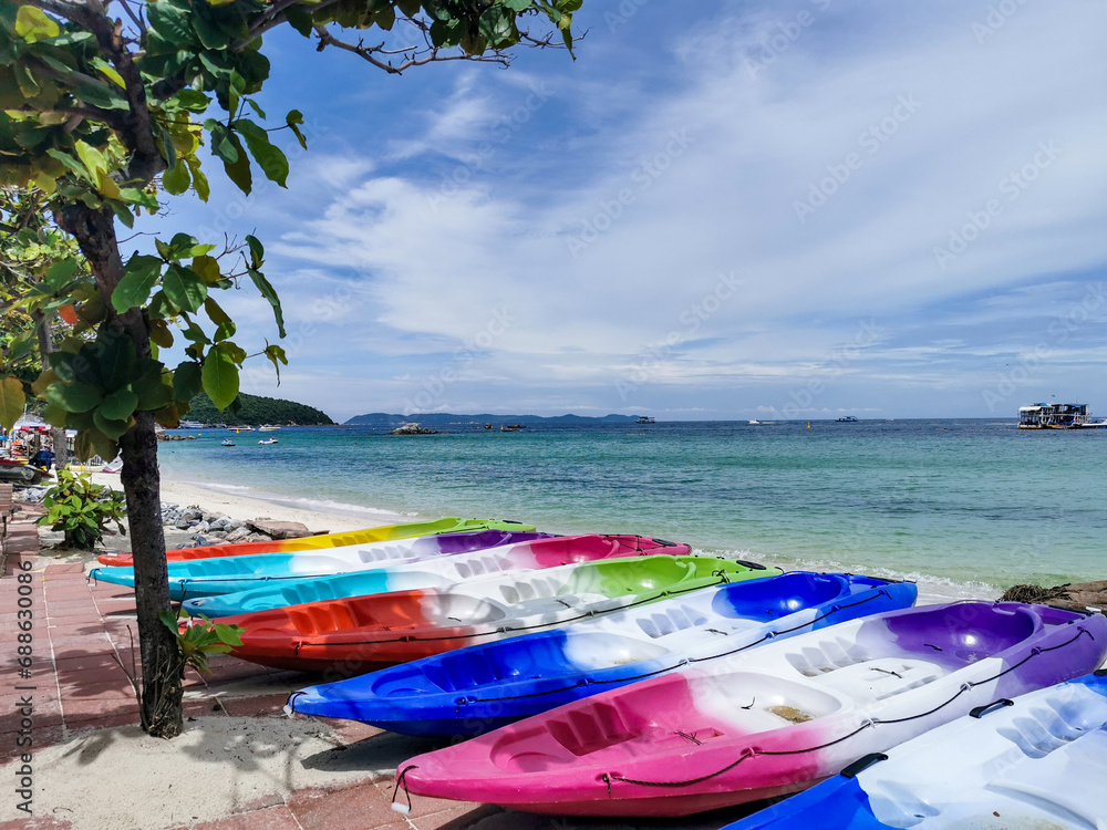 The view of rowboats lined up along the beach The view of rowboats lined up along the beach