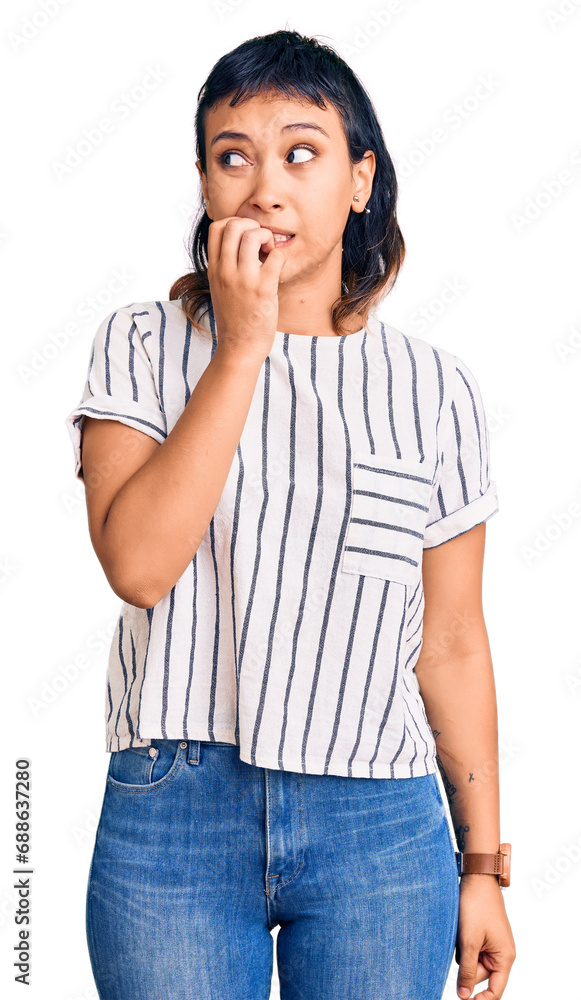 Young woman wearing casual clothes looking stressed and nervous with hands on mouth biting nails. anxiety problem. Young woman wearing casual clothes looking stressed and nervous with hands on mouth biting nails. anxiety problem.