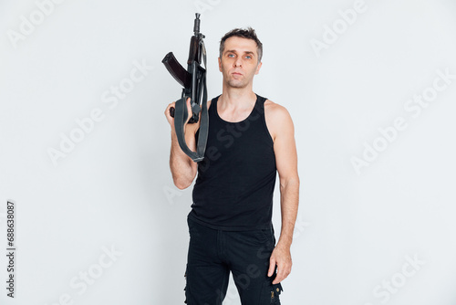 A man with a machine gun on a white background