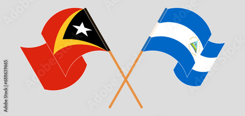 Crossed and waving flags of East Timor and Nicaragua photo