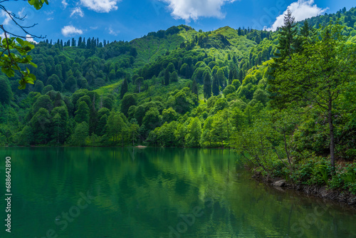 Artvin Borcka Kara Lake and surrounding natural view mountains clouds and trees © Aytug Bayer