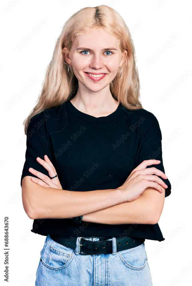Young caucasian woman wearing casual clothes happy face smiling with crossed arms looking at the camera. positive person. Young caucasian woman wearing casual clothes happy face smiling with crossed arms looking at the camera. positive person.
