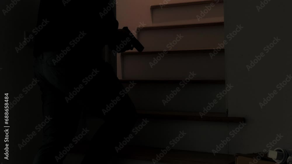 Mysterious Man Wearing Black Hoodie Holding A Pistol Wearing A Cloth