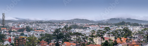 View on roofs in the city of Dalat. Da Lat and the surrounding area is a popular tourist destination of Asia. City with fogs and mountains