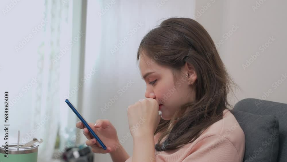 Man wearing casual clothes uses smartphone at coffee shop cafe chatting typing message on cell phone Man wearing casual clothes uses smartphone at coffee shop cafe chatting typing message on cell phone