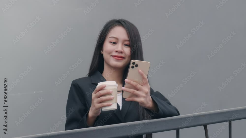 woman wearing light-colored coat, walking city streets and using mobile device to chat with her friends. woman wearing light-colored coat, walking city streets and using mobile device to chat with her friends.