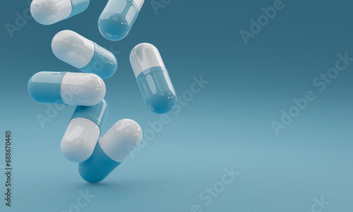 Group of blue and white medication capsules falling on light blue background with copy space. Concept of pharmaceutical and medical treatment. 3d render.