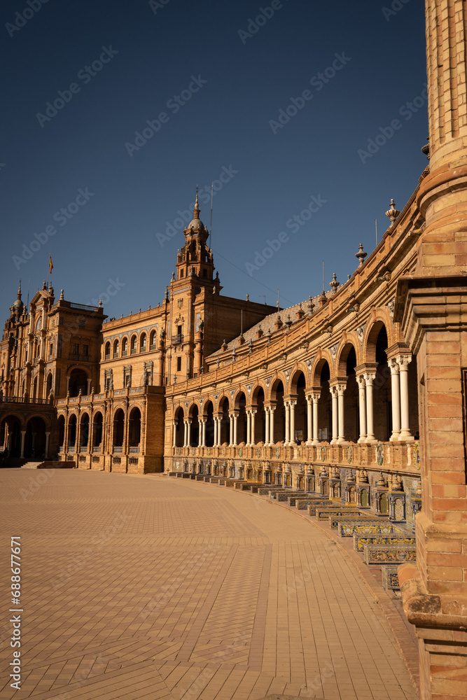 The National Geographic Institute in Plaza de España Seville city Spain. Central government offices in stunning rich wealthy architecture design on sunny day. Impressive symmetrical masonry   
