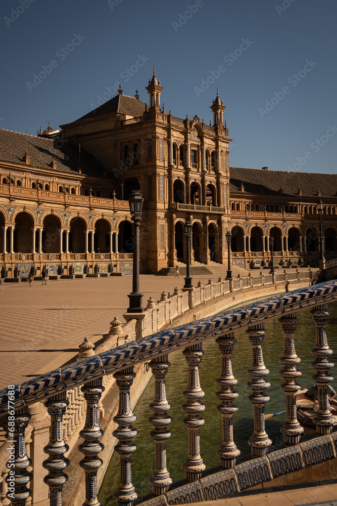 The National Geographic Institute in Plaza de España Seville city Spain. Central government offices in stunning rich wealthy architecture design on sunny day. Impressive symmetrical masonry   