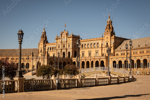 The National Geographic Institute in Plaza de España Seville city Spain. Central government offices in stunning rich wealthy architecture design on sunny day. Impressive symmetrical masonry 